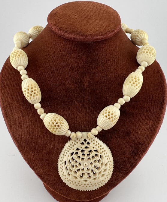Antique Carved Bone Beaded Necklace Strand: Antique Carved Bone Beaded Necklace Strand. Carved cow bone or ox bone antique beaded necklace strand with pendant. Measures approximately 16.5 inches in length. Pendant measures approximately 1.75 in