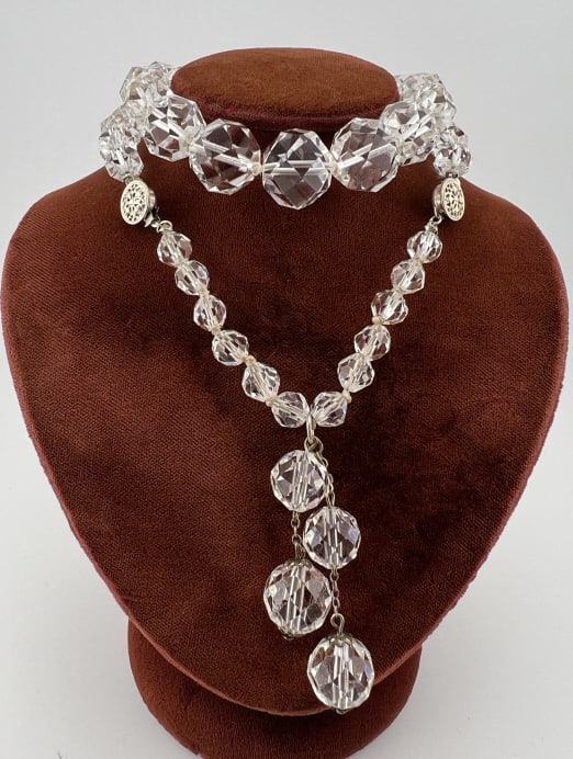Antique Art Deco Flapper Style Crystal Necklace: Antique Art Deco Flapper Style Crystal Necklace w Tassel Drop at Back of Neck. Hand knotted necklace strand with graduated size faceted crystal beads and filigree clasps. Measures approximately 19 inc