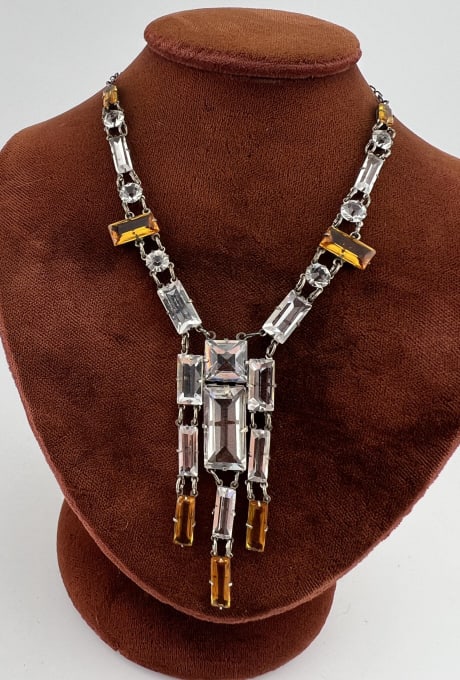 Antique Art Deco Flapper Sterling Crystal Necklace: Antique Art Deco Flapper Era Sterling Silver & Faceted Crystal Necklace. In clear and citrine tone crystal. Clasp is hallmarked. Measures approximately 16 inches in length.