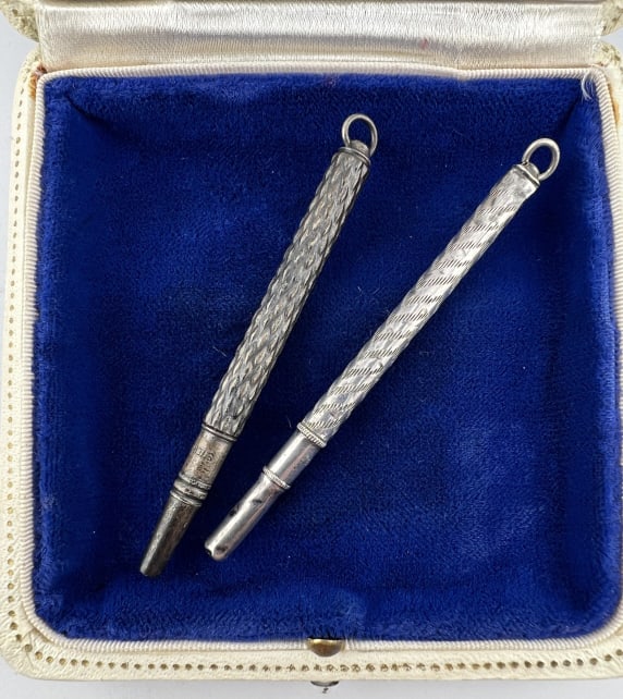 Antique Sterling Silver Chatelaine Pen Pendants: Two Antique Sterling Silver Chatelaine Pen / Pencil Pendants. Both are hallmarked / stamped for sterling. Approximately 3 inches and under in length.