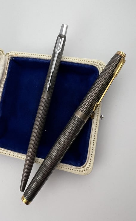 Two Vintage Parker Sterling / Silver Pens: Two Vintage Parker Sterling / Silver Pens. Both are signed Parker. One is hallmarked sterling silver. Approximately 5 to 5.5 inches each.