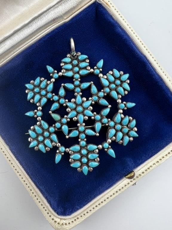 Large Native American Sterling Turquoise Pendant: Large Native American Sterling Turquoise Pendant. Can be worn as necklace pendant or as a brooch. Measures approximately 2.5 inches in diameter. Acid tests for sterling silver.