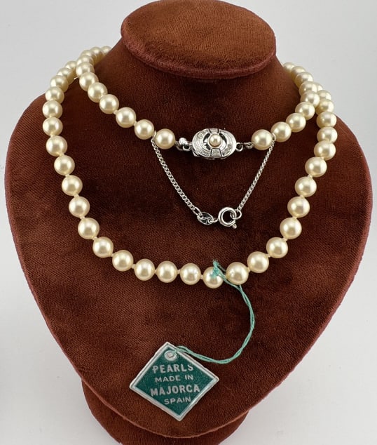 Vintage Strand of Majorca Pearls w Sterling Clasp: Vintage Strand of Majorca Pearls w Sterling Clasp. Original tag. Hand knotted. Measures 23 inches in length. Clasp is hallmarked.