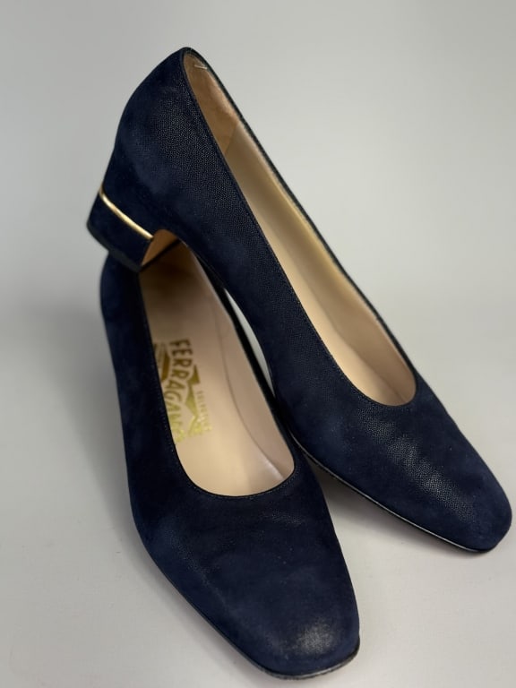 Vintage Navy Blue Salvatore Ferragamo Pumps Heels: Vintage Navy Blue Leather Salvatore Ferragamo Pumps Heels with short heel having gold tone signed metal accent. Labeled Salvatore Ferragamo Florence Made in Italy - marked size 7.5. Measuring approxim