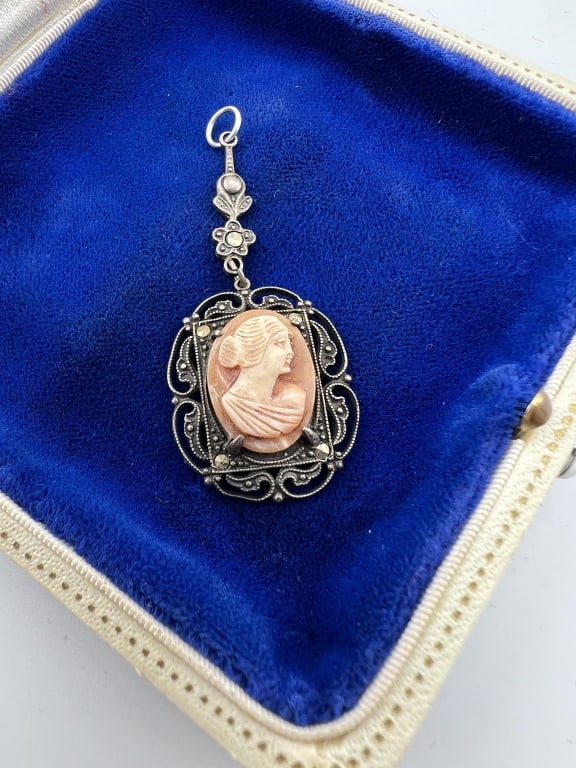 Art Deco Sterling & Marcasite Cameo Pendant: Art Deco Sterling & Marcasite Cameo Pendant. Portrait scene of a woman in profile, stamped STERLING on the back. Measures 2 inches in length.