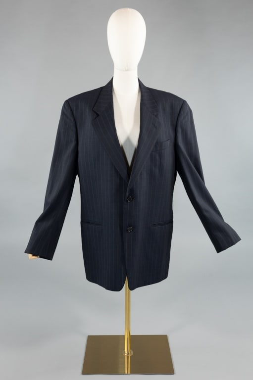 Vintage Valentino Pinstripe Wool Blazer Jacket: Vintage Valentino Uomo Navy Blue Pinstripe Wool Blazer Jacket. Fully lined with notched lapel and three front welt pockets. Single breasted at front with two buttons. Measures 23 inches flat across ch