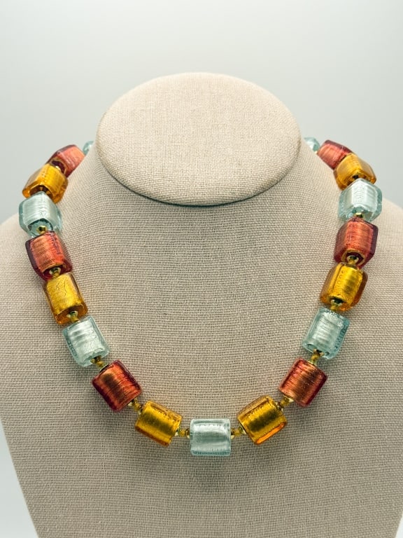 Vintage Murano Multicolored Glass Beaded Necklace: Vintage Murano Multicolored Glass Beaded Necklace having multicolored square glass beads with metal accents on knotted string rope. Closes with lobster clasp. Measures 19 inches long. Comes with origi