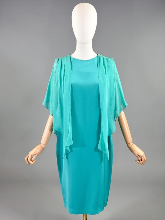 Vintage 1980s Emmelle Silk Flutter Sleeve Dress: Vintage 1980s Emmelle Silk Flutter Sleeve Dress having fluttered sleeves and shift style through body with back zip closure. Labeled Emmelle - marked size S. Measuring 38 inch but, 36 inch waist, 38 i