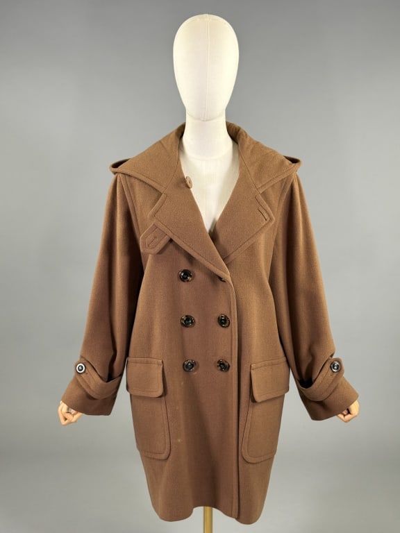 Vintage 2000s Saks Fifth Avenue Cashmere Hood Coat: Vintage 2000s Saks Fifth Avenue Cashmere Hood Coat having notched lapel with hood at neck, double breasted button front closure, & front patch pockets with flaps, fully lined. Measuring 23 inch bust, 