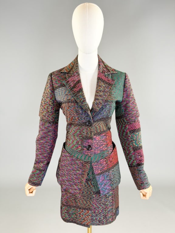 Vintage 1990s Issey Miyake Woven Skirt Suit: Vintage 1990s Issey Miyake Woven Skirt Suit having button front closure on both. Jacket measuring 38 inch bust, 34 inch waist, 25 inches long, 23 inch sleeve length. Skirt measuring 30 inch waist, 18 