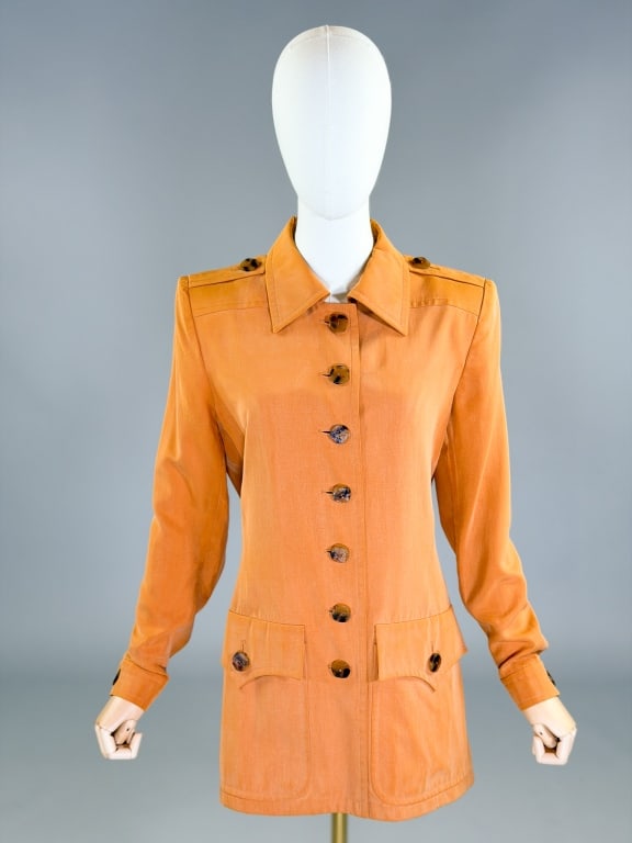 Vintage 1980s Yves Saint Laurent Silk Blazer: Vintage 1980s Yves Saint Laurent Silk Blazer having button front closure. Marked size 40. Measuring 38 inch bust, 32 inch waist, 30 inches long, 25 inch sleeve length. General wear as shown throughout