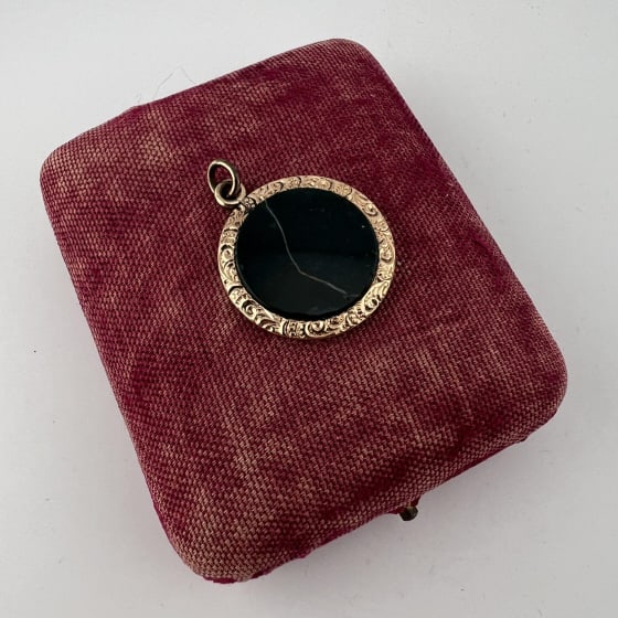 Antique 19th C Banded Agate Gold Filled Pendant: Antique 19th C Banded Agate Gold Filled Pendant. Necklace pendant or fob. Banded agate disc, black with white veining. Gold filled frame. Measures just over 1.25 inches in length with the bail.