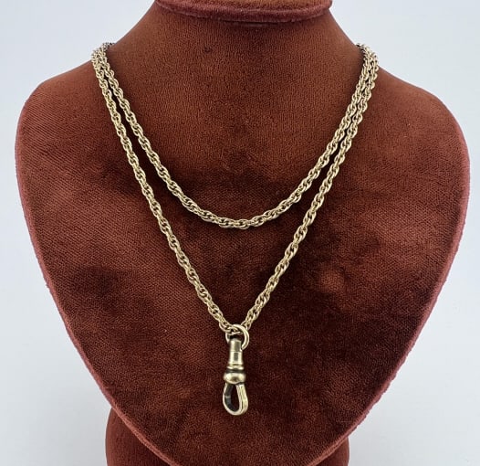 Estate Gold Filled Necklace Chain w Dog Clip: Estate Gold Filled Necklace Chain w Dog Clip. Rope twist motif necklace chain with clasp hallmarked for gold filled. Set with a dog clip to hold a pendant or collection of charms. Chain measures 24 in