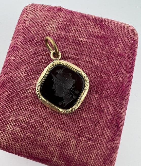 Antique 19th C Carved Carnelian Intaglio Pendant: Antique 19th C Carved Carnelian Intaglio Pendant. Necklace pendant / fob / charm in gold filled frame. Measures just under 1.5 inches in length with the bail. Greco Roman style portrait intaglio.