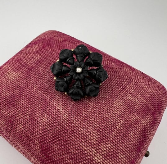 Antique 19th C Victorian Mourning Floral Brooch: Antique 19th C Victorian Era Mourning Floral Brooch. Seed pearl accent at center. Gold filled mount. Measures nearly 1 inch in diameter.