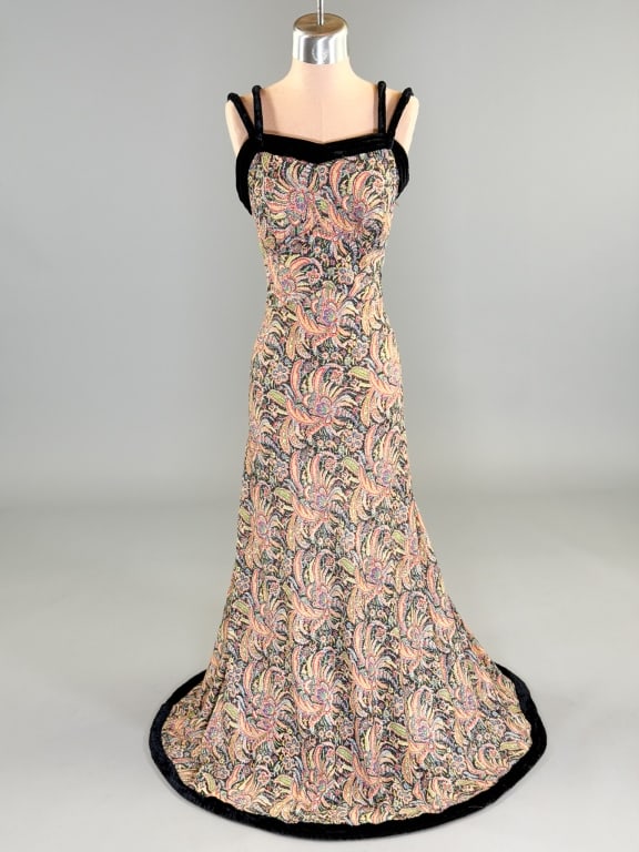 Vintage 1930s Paisley Lame Stitched Evening Gown: Vintage 1930s Paisley Lame Stitched Evening Gown having Deco seaming through waist, bias cut with stretch, side zip closure and velvet details at bust, straps, and hem. Measuring 32-34 inch bust, 24-2