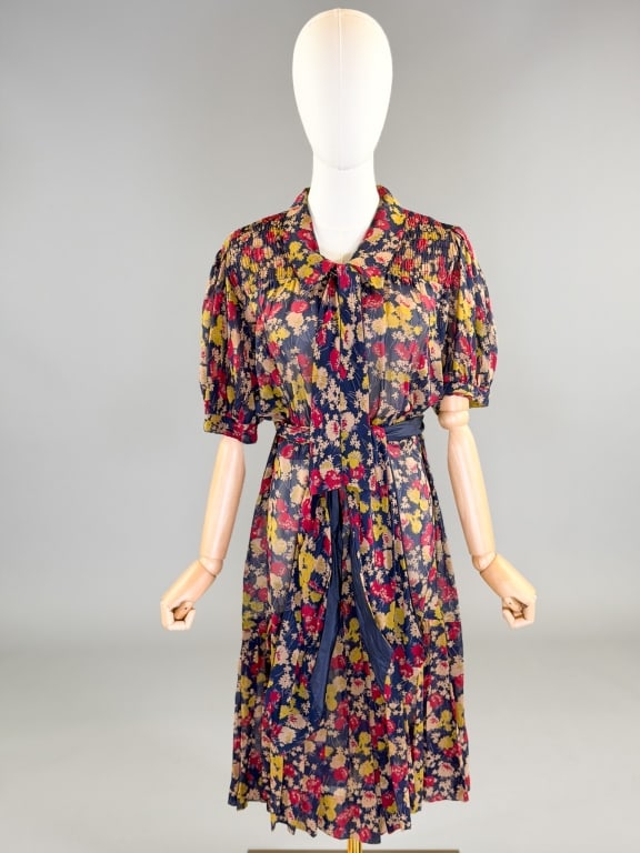 Vintage 1930s Floral Silk Chiffon Day Dress: Vintage 1930s Floral Silk Chiffon Day Dress having collar at neck with tie, drop waist with pleated skirt, closing at side and front with snaps and hooks, removable belt at waist. Measuring 34-40 inch