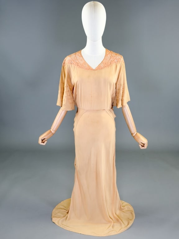 Vintage 1930s Rayon Bias Cut Lace Gown Dress: Vintage 1930s Rayon Bias Cut Lace Gown Dress having lace detail at neck with fluttered sleeves, bias cut throughout with side snap closures. Measuring 32-38 inch bust, 24-30 inch waist, 53 inches long