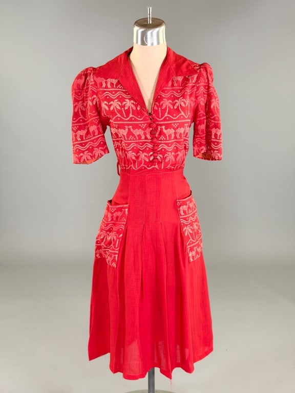 Vintage 1930s Camel Print Linen Day Dress: Vintage 1930s Camel Print Linen Day Dress having button front and side closure with two front pockets. Measuring 34 inch bust, 26 inch waist, 38 inches long, 11 inch sleeve length. General wear, holes