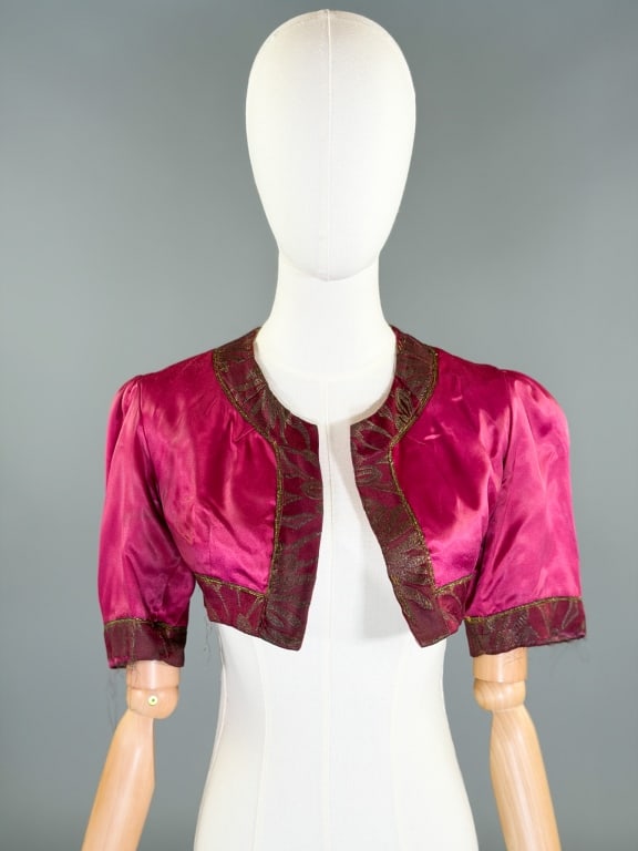 Vintage 1930s Silk Satin Lame Bolero Top Jacket: Vintage 1930s Silk Satin Lame Bolero Top Jacket having floral lame trim, no closure at front. Measuring free bust, 12 inches long, 11 inch sleeve length. General wear and shredding throughout as shown