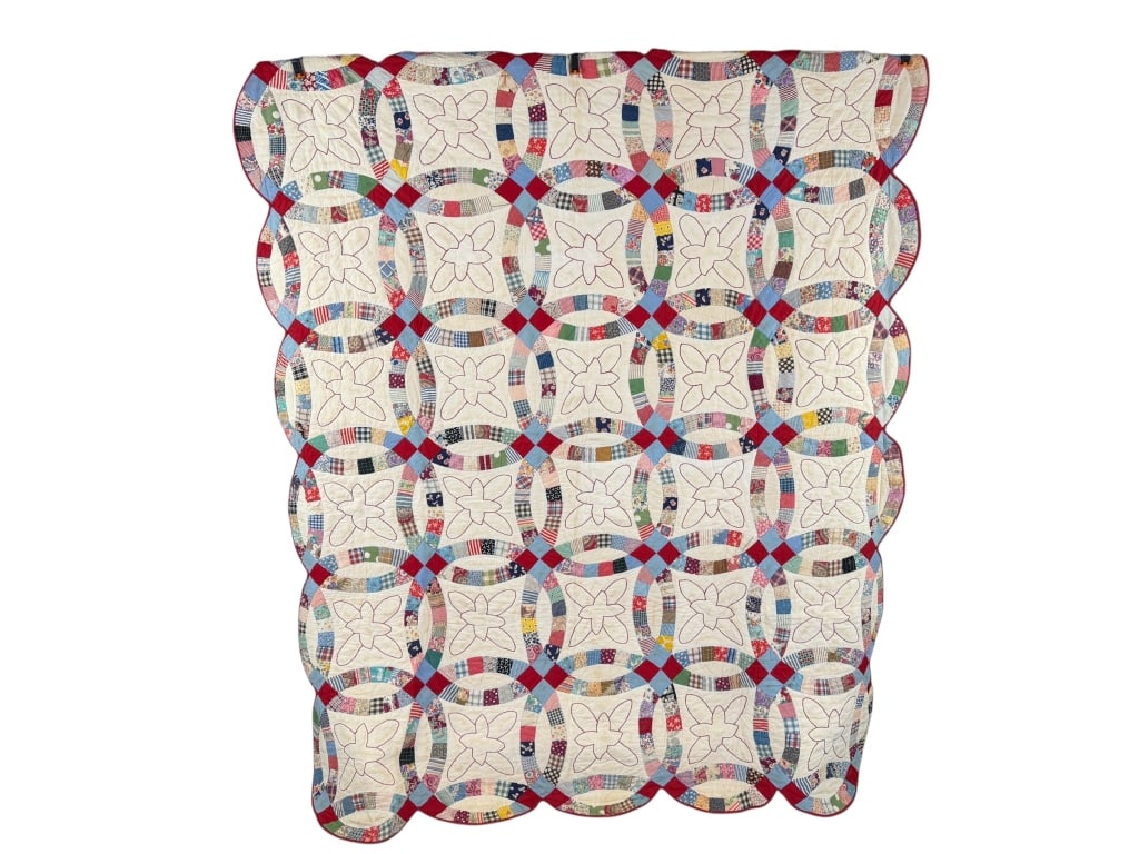 Vintage 1930s Cotton Feedsack Wedding Ring Quilt: Vintage 1930s Embroidered Cotton Feedsack Wedding Ring Quilt having general wear holes and spots as shown throughout. Measuring approximately 76 inches by 64 inches.