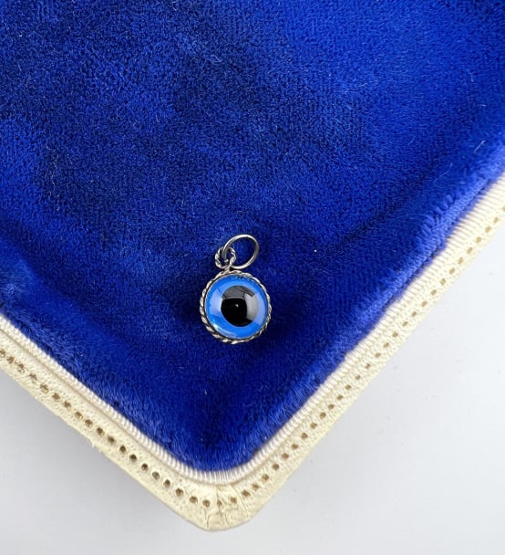Vintage Sterling Silver Art Glass Evil Eye Pendant: Vintage Sterling Silver Art Glass Evil Eye Necklace Pendant or Charm. Tests as sterling. Measures approximately 1/2 of an inch in length.