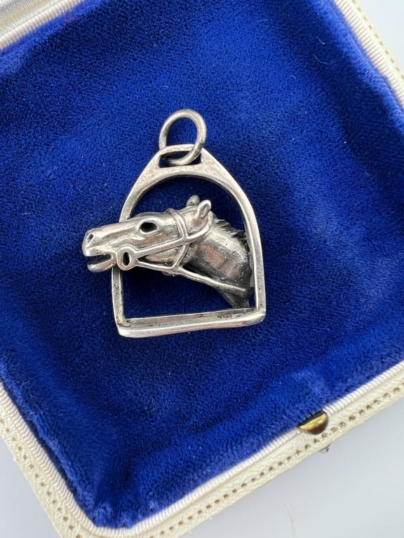 Vintage Sterling Equestrian Necklace Pendant: Vintage Sterling Silver Equestrian Necklace Pendant. Horse head with stirrup design. Tests as sterling silver although unmarked. Measures 1.5 inches in length.