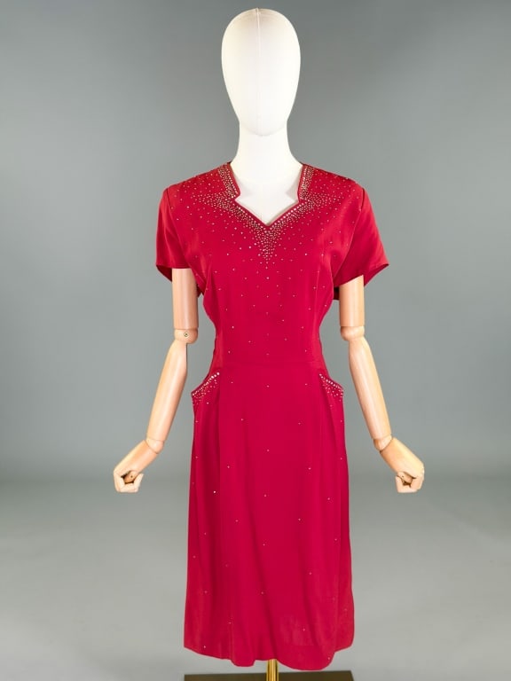 Vintage 1950s Crepe Rhinestone Studded Dress: Vintage 1950s Crepe Rhinestone Studded Dress having rhinestone and metal studs throughout with center back neck and side zip closures. Labeled Original Lovette Fashions. Measuring 44 inch bust, 34 inc