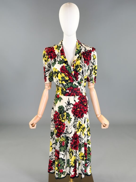 Vintage 1940s Rayon Knit Floral Print Dress: Vintage 1940s Rayon Knit Floral Print Dress having side zip closure. Measuring 34-40 inch bust, 26-28 inch waist, 43 inches long, 11 inch sleeve length. Extensive wear throughout as shown.