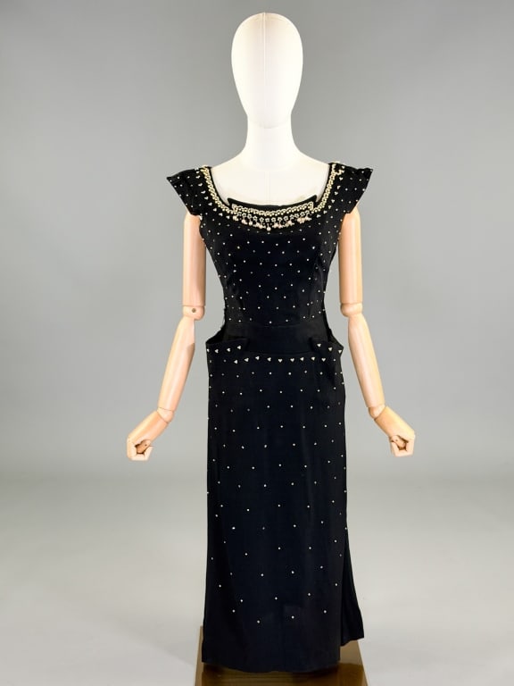 Vintage 1950s Crepe Pearl Beaded Wiggle Dress: Vintage 1950s Crepe Pearl Beaded Wiggle Dress having beaded and rhinestone details throughout, side zip closure and two front pockets. Labeled Claudia Young Original. Measuring 36 inch bust, 27 inch w