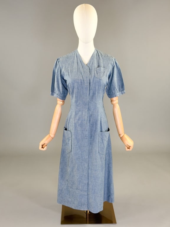 Vintage 1940s Chambray Cotton Work Uniform Dress: Vintage 1940s Chambray Cotton Work Uniform Dress having button front closure with front patch pockets. Labeled Marvin Neitzel Corp. Measuring 36 inch bust, 30 inch waist, 43 inches long, 11 inch sleev