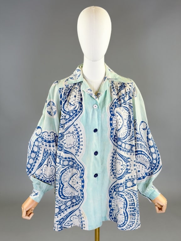 Vintage 1940s Paisley Cotton Smock Top Jacket: Vintage 1940s Paisley Cotton Smock Top Jacket having button front closure, labeled Gerson Kaufman. Measuring 48 inch bust, 29 inches long, 25 inch sleeve length. General wear and mismatched buttons th