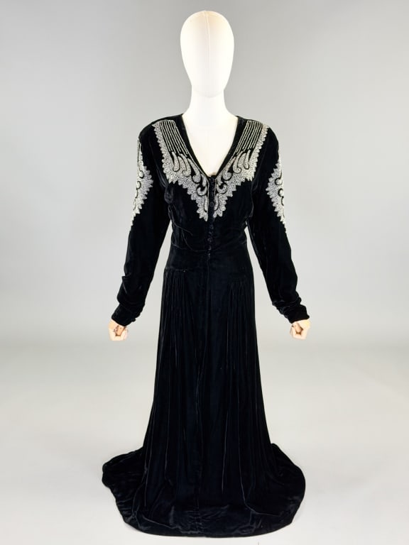 Vintage 1940s Silk Velvet Beaded Evening Gown: Vintage 1940s Silk Velvet Beaded Evening Gown having beaded details throughout with button, hook, and snap front closure. Measuring 46 inch bust, 34 inch waist, 56 inches long, 25 inch sleeve length. 