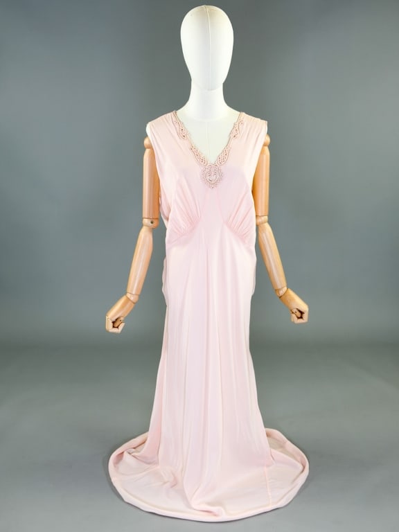 Vintage 1940s Rayon Bias Cut Slip Dress Night Gown: Vintage 1940s Rayon Bias Cut Slip Dress Night Gown having fagoting detail at bust, bias cut throughout with stretch, labeled Tranel, marked size 40. Measuring 34-44 inch bust, 30-40 inch waist, 58 inc
