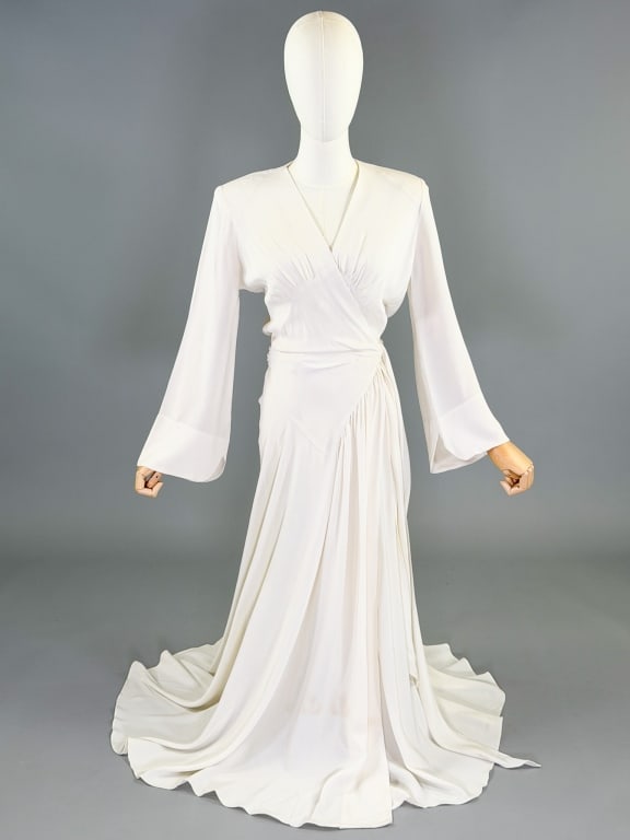 Vintage 1940s Crepe Dressing Gown Wrap Robe Jacket: Vintage 1940s Crepe Dressing Gown Wrap Robe Jacket having asymmetrical ruching throughout with wrap tie waist closure, labeled Flobert. Measuring 58 inches long, 24 inch sleeve length, with adjustable