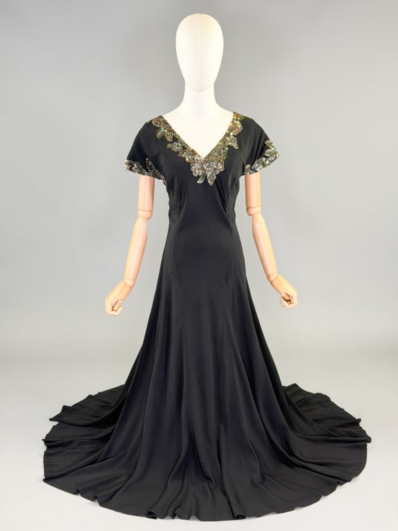 Vintage 1940s Crepe Sequin Evening Gown Dress: Vintage 1940s Crepe Sequin Evening Gown Dress having sequin details through bust and sleeves with side zip closure. Measuring 38-44 inch bust, 32-36 inch waist, 57 inches long, 5 inch sleeve length. G