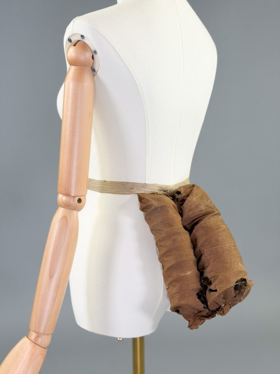 Antique Victorian 1880s Wire Spring Bustle Pad: Antique Victorian 1880s Wire Spring Bustle Pad having waist belt with metal hook closure. General wear, spots, and holes as shown throughout. Bustle pad measuring approximately 9 inches long by 7 inch