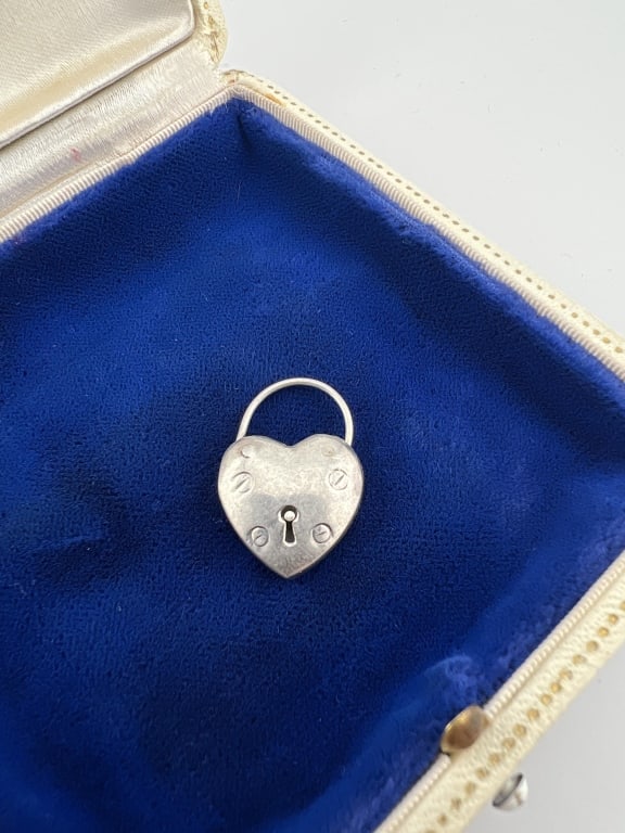 Sterling Silver Heart Form Padlock Pendant / Clasp: Sterling Silver Heart Form Padlock Pendant / Clasp. Hallmarked. Loop on the top opens as a latch. Measures 1 inch in length.