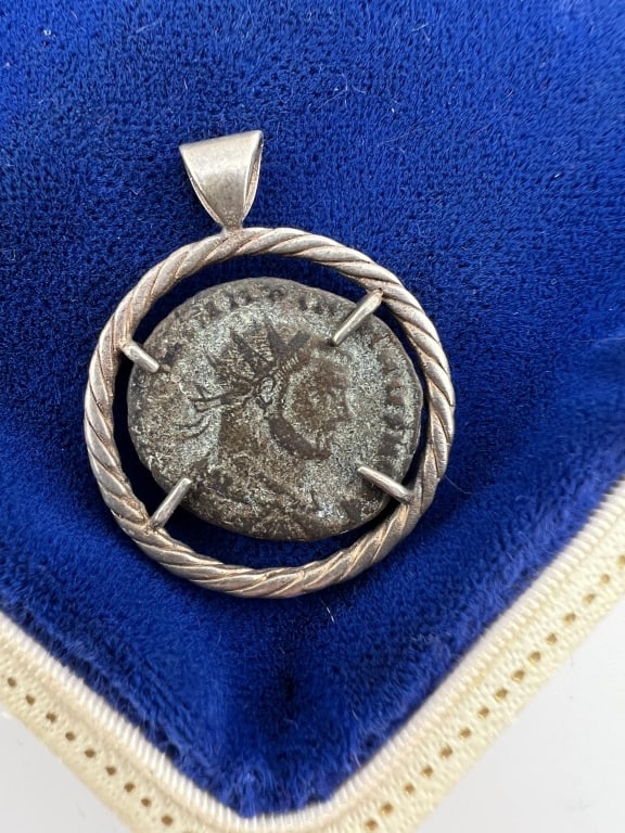 Sterling Necklace Pendant w Ancient Roman Coin: Sterling Silver Necklace Pendant w Ancient Roman Bronze Coin. Coin is prong set and not soldered. Measures just over 1.25 inches in length.