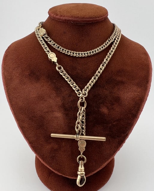 Antique Gold Filled Curb Link Watch Chain Necklace: Antique Gold Filled Curb Link Watch Chain Necklace. Set with a dog clip for pendant / charms, T bar, spring ring clasp and floral motif caps to one section of chain as well as the extender with the do