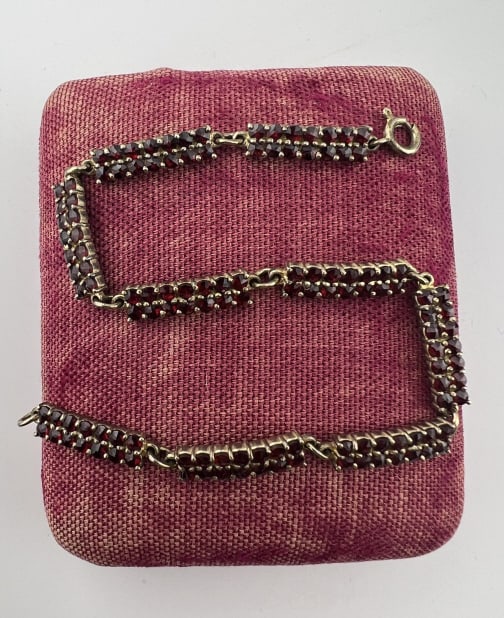 Antique Gold Rose Cut Garnet Articulated Bracelet: Antique Gold Rose Cut Garnet Articulated Bracelet. Articulated panel bracelet with spring ring clasp. Very low karat "garnet gold" or gold plated. Measures just over 8 inches in length.
