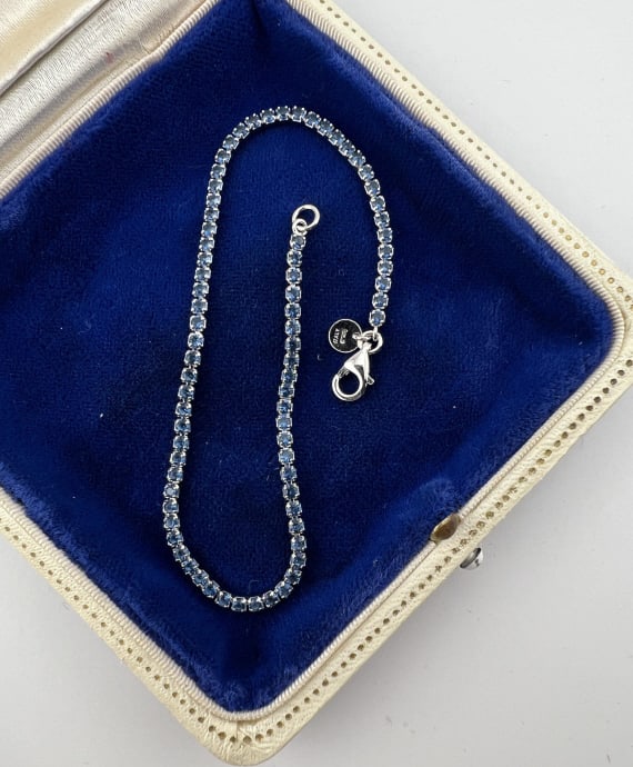 Italian Sterling Silver & Sapphire Tennis Bracelet: Italian Sterling Silver & Sapphire Tennis Bracelet. Articulated tennis bracelet, hallmarked 925 and ITALY, stones may be treated or enhanced. Measures 8.25 inches in length.