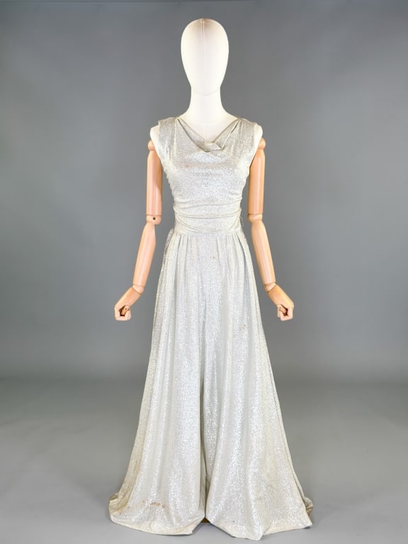 Vintage 1960s Saks Lurex Metallic Palazzo Jumpsuit: Vintage 1960s Saks Lurex Metallic Palazzo Jumpsuit having center back zip closure. Measuring 32-36 inch bust, 24-26 inch waist, 58 inches long. General wear and spots as shown throughout.