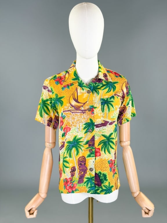 Vintage 1970s Rayon Hawaiian Tiki Polo Shirt Top: Vintage 1970s Rayon Hawaiian Tiki Polo Shirt Top having button front closure with loop collar and single front breast pocket. Labeled Offspring - marked size S. Measuring 34 inch bust, 22 inches long,