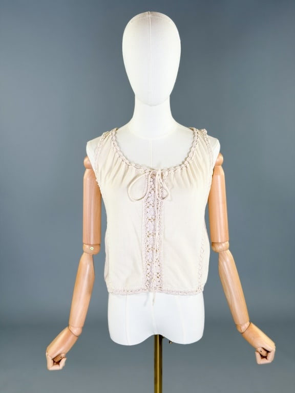 Vintage 1970s Cotton Crochet Camisole Top: Vintage 1970s Cotton Crochet Camisole Top having crochet details with adjustable tie neck. Measuring 34-40 inch bust, 18 inches long. General wear as shown throughout.