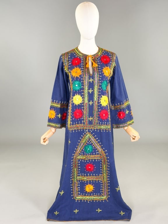 Vintage 1970s Indian Embroidered Caftan Dress: Vintage 1970s Indian Embroidered Caftan Dress having tie at neck with embroidery and mirror details throughout. Labeled Rajkumari - marked size 7/8. Measuring 38 inch bust, 36 inch waist, 50 inches lo