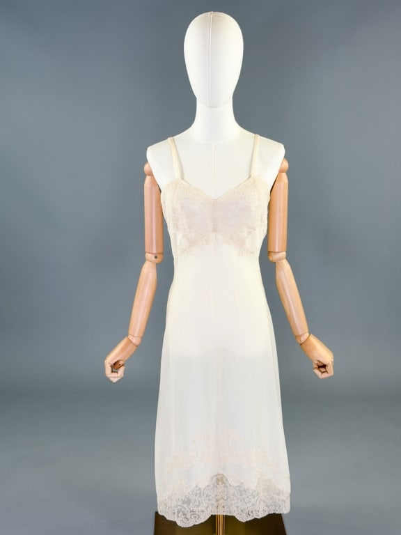 Vintage 1960s Knit Lace Slip Dress Night Gown: Vintage 1960s Nylon Knit Lace Slip Dress Night Gown having lace details throughout, knit with stretch, no closures. Measuring 32-38 inch bust, 26-34 inch waist, 43 inches long. General wear and spots 