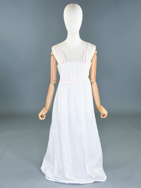 Vintage 1970s Eyelet Lace Ribbon Slip Dress: Vintage 1970s Eyelet Lace Ribbon Slip Dress. Marked size small, with elastic waist. Measuring 34 inch bust, 26-34 inch waist, 53 inches long.