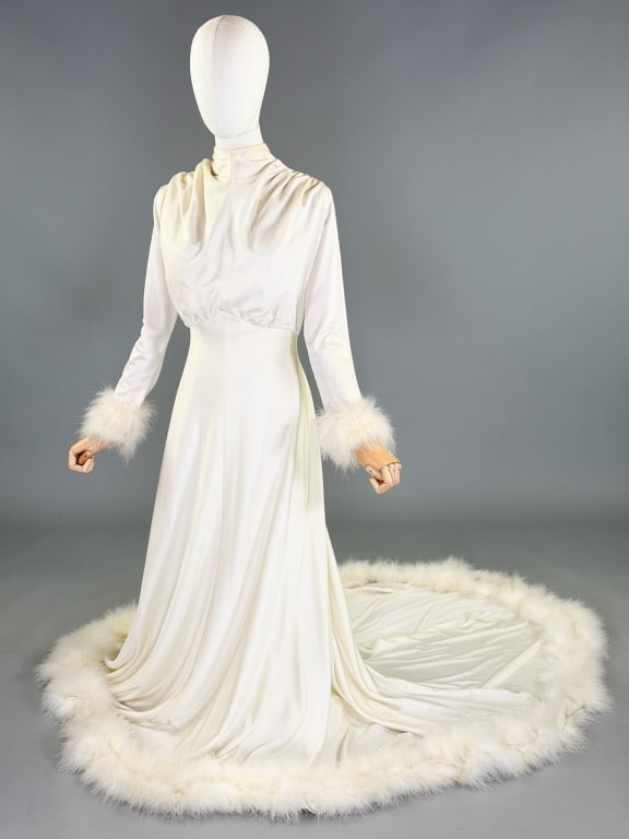 Vintage 1970s Poly Knit Marabou Feather Trim Gown: Vintage 1970s Poly Knit Marabou Feather Trim Gown having back zip closure and marabou feather trip, hem and sleeve cuffs. Measuring 32-38 inch bust, 28-30 waist, 60 inch front length, 76 inch back len