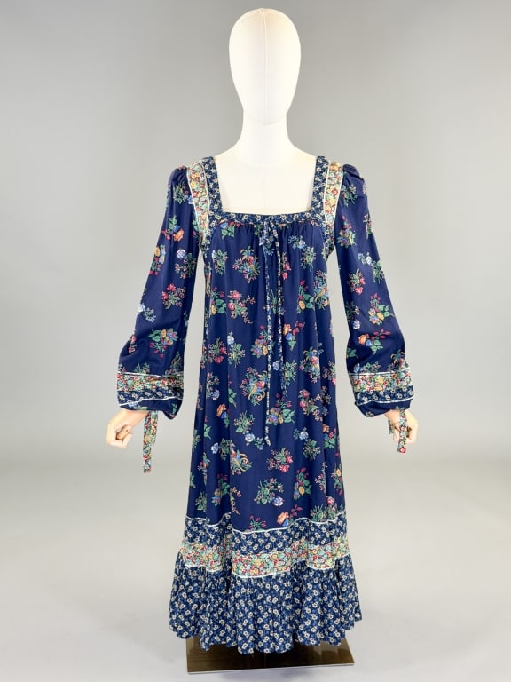 Vintage 1970s Gunne Sax Floral Cotton Dress: Vintage 1970s Gunne Sax Floral Cotton Dress having center back zip closure, marked size 11. Measuring 38 inch bust, 44 inch waist, 44 inches long, 28 inch sleeve length. General wear as shown througho